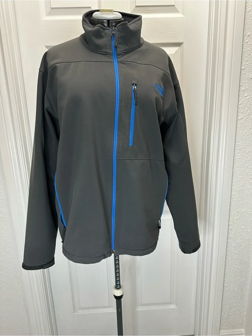 The North Face Men's Charcoal Gray Jacket with Blue Zippers